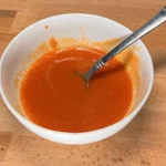 Freshly made Buffalo Sauce ideal for dipping and coating chicken wings.