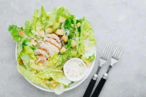 Nutrition 3 Chicken Caesar salad with grilled chicken, fresh romaine lettuce, Parmesan cheese, and creamy Caesar dressing