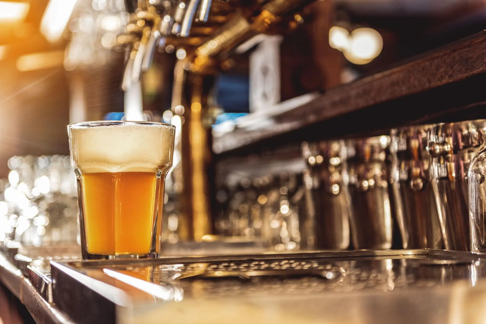 Ice-cold draft beer served during Twin Peaks Happy Hour