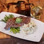 Tender New York Strip Steak with a rich seared crust and flavorful interior.