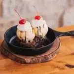 Twin Peaks Sundae topped with rich ice cream, chocolate sauce, and whipped cream.