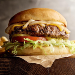 Classic cheeseburger served with fresh vegetables and golden fries