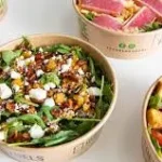 Crisp salads featuring lettuce, onion, and seasonal vegetables.